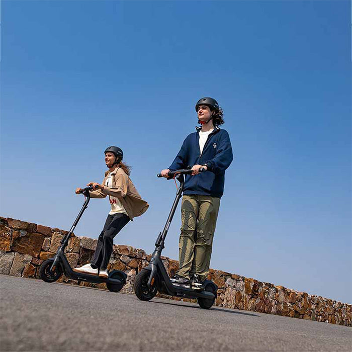 Segway Ninebot E2 Pro lifestyle couple riding