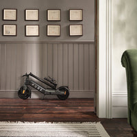 pure advance+ electric scooter lifestyle mercury grey wall