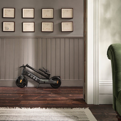 pure advance+ electric scooter lifestyle mercury grey wall