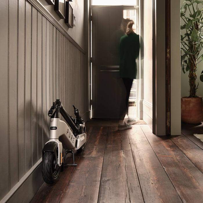 pure advance+ electric scooter lifestyle platinum silver hallway