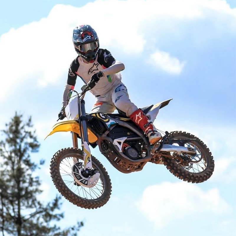 Sur-Ron Storm Bee F Electric Dirt Bike Jumping in Air