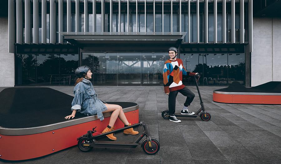 Man and Woman enjoying the Xiaomi Pro electric scooter